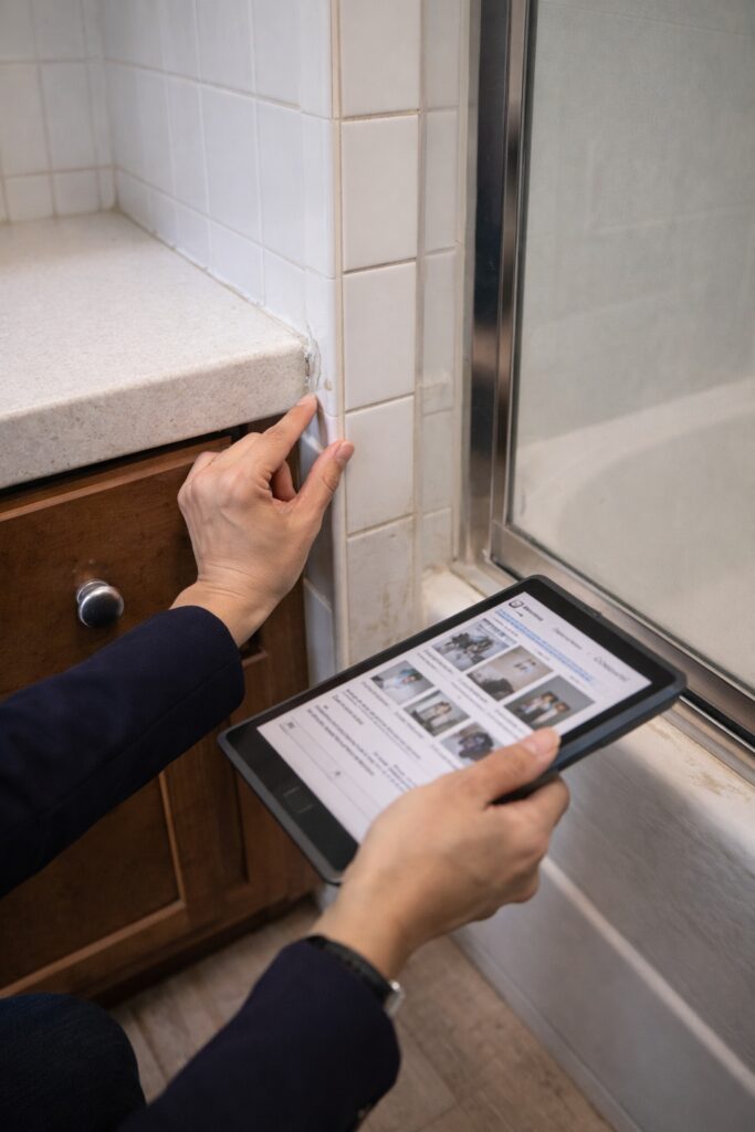 rental property damage inspection Ventura County checking tile and caulking condition in bathroom